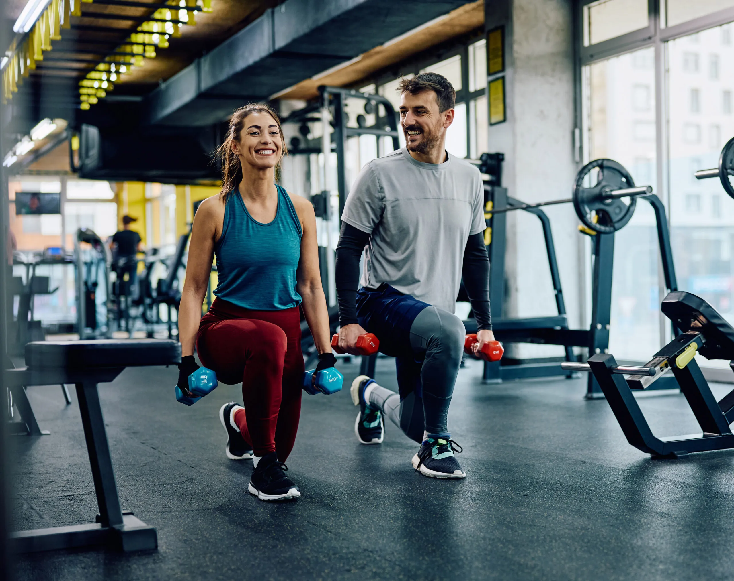 Cardio machines arranged in a well-equipped modern gym