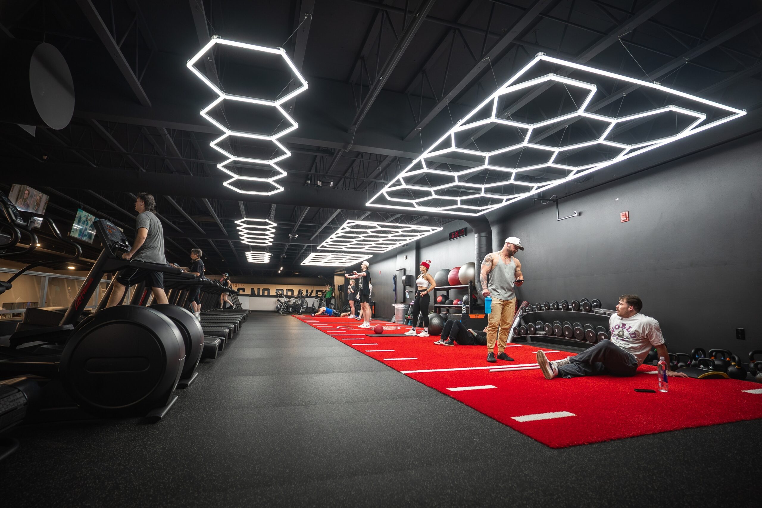 Athlete performing a controlled strength exercise with gym equipment